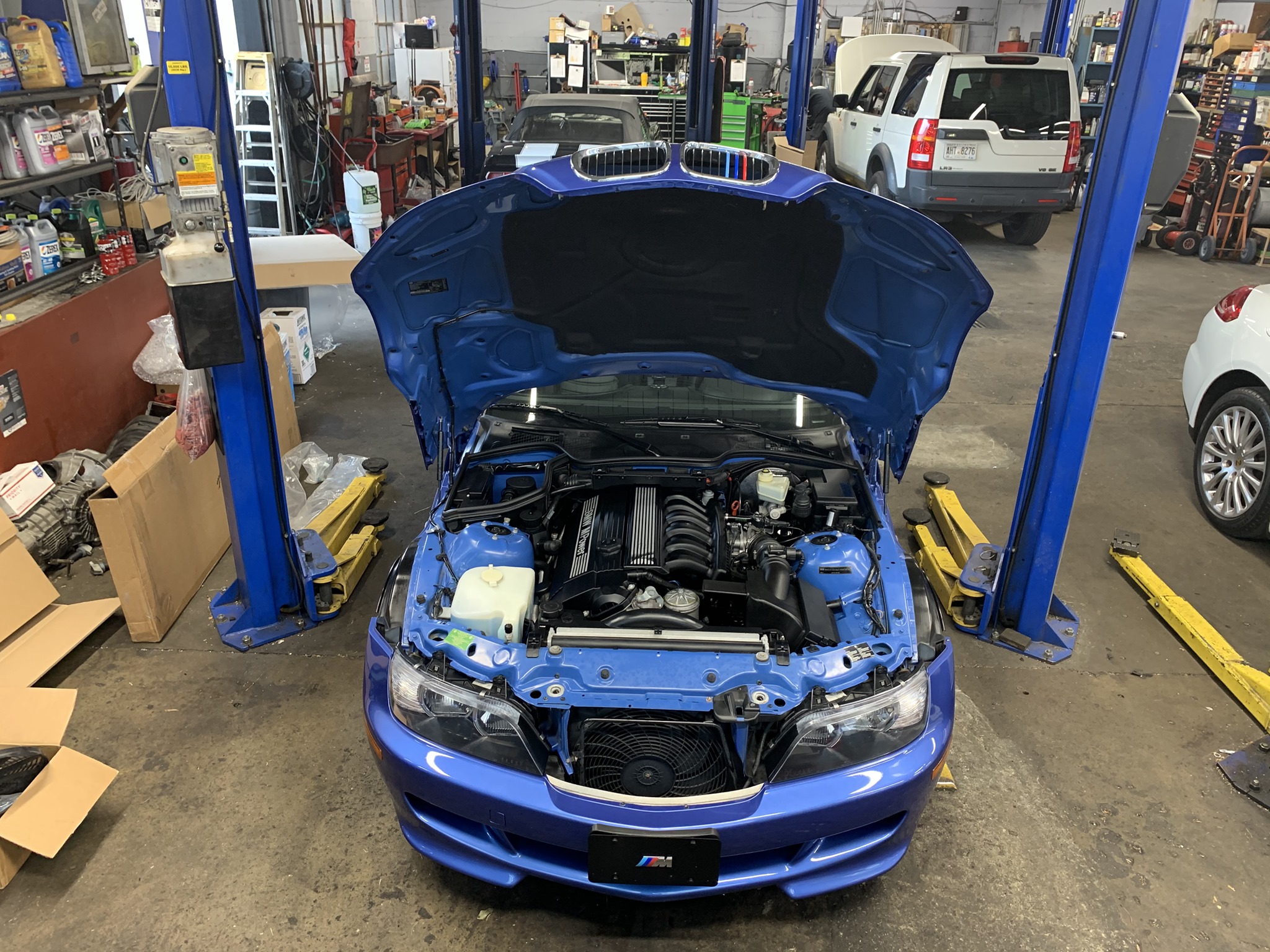 | Buckhead Imports BMW Z3 with hood open showing installed supercharger in Atlanta